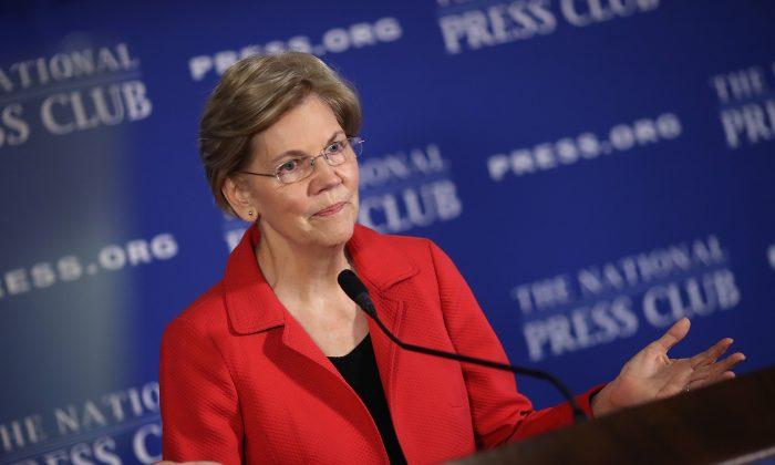 Warren Accuses Police Officer Cleared by Obama’s DOJ of Murdering Michael Brown