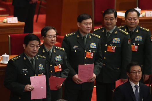 (L-R) Generals of the People’s Liberation Army Chang Wanquan, Fang Fenghui, Zhang Yang, Zhao Keshi, and Zhang Youxia line up to cast their votes into a box during the fifth plenary meeting of the National People’s Congress at the Great Hall of the People in Beijing, China, on March 15, 2013.  (Feng Li/Getty Images)