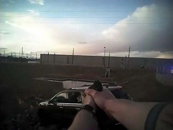 Police bodycam shows a Denver Police Department officer pointing his weapon in the direction of a vehicle containing Steven Lee Nguyen, 27, and Rafael Landeros Jr., 24, Denver, Colorado, on March 19, 2018. (Denver Police Department)
