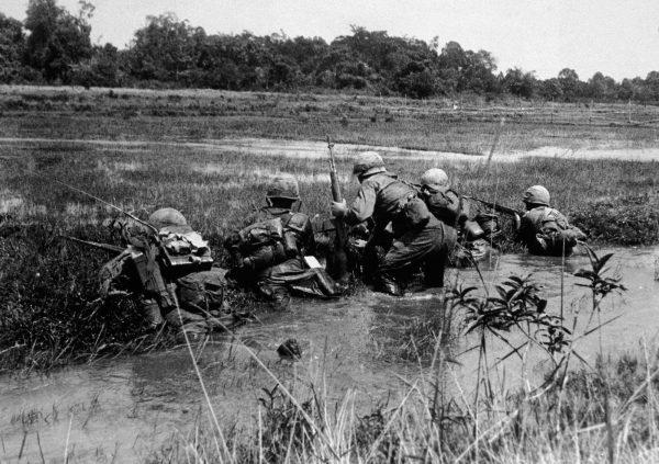 File photo showing a US Army combat platoon preparing to advance on a Viet Cong sniper position, in Vietnam, mid-1960s. (Hulton Archive/Getty Images)
