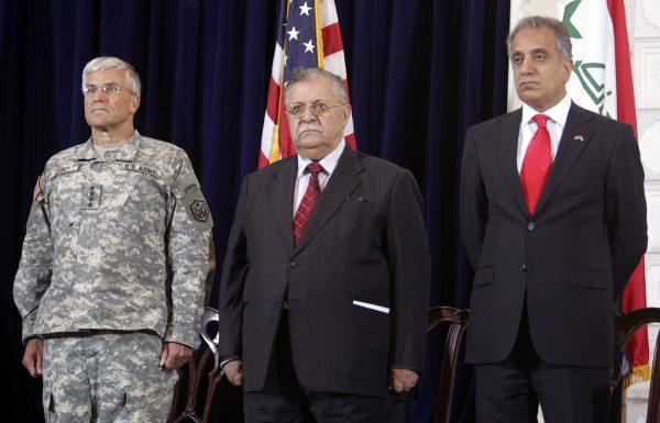 Iraqi President Jalal Talabani (C) is flanked by U.S. ambassador to Iraq Zalmay Khalilzad (R), and U.S. forces commander in Iraq General George Casey as they attend the United States independence day anniversary celebration at the U.S. embassy in Baghdad, Iraq, on July 4, 2006. (Ali Jasim - pool/Getty Images)
