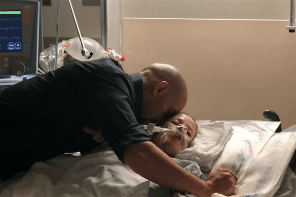 Zach Kincaid embraces his wife Kristil in the hospital after an alleged drunk driver hit her vehicle head-on in Hemet, Calif. (Zach Kincaid/GoFundMe)