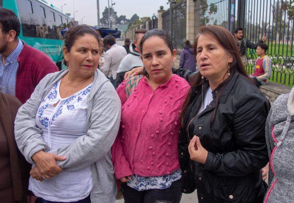 Jacqueline Castillo (R) and other members of the Madres de Soacha collective gather on Oct. 13, 2018 in Bogota, Colombia, ahead of their journey to commemorate ten years since the peak of the “extrajudicial killings.” (Luke Taylor/Special to The Epoch Times)