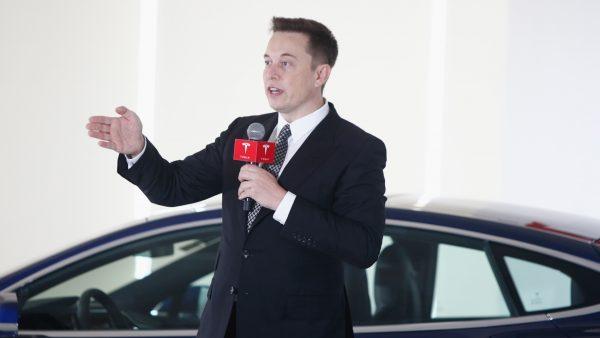 Elon Musk, Chairman, CEO and Product Architect of Tesla Motors, addresses a press conference to declare that the Tesla Motors releases v7.0 System in China on a limited basis for its Model S, which will enable self-driving features such as Autosteer for a select group of beta testers in Beijing, China, on Oct. 23, 2015. (VCG/Getty Images)