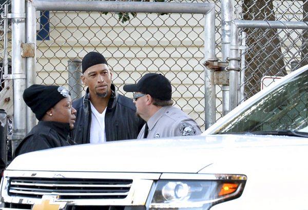 Former Carolina Panthers NFL football player Rae Carruth, center, exits the Sampson Correctional Institution in Clinton, N.C., on Oct. 22, 2018. (Jeff Siner/The Charlotte Observer via AP)