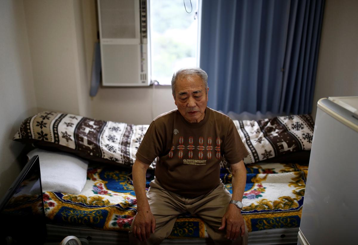 Sumitaka Haraguchi sits on a bed in a room of a nursing home where he lives during an interview with Reuters in Yokosuka, Japan September 11, 2018. (Kim Kyung-Hoon/Reuters)