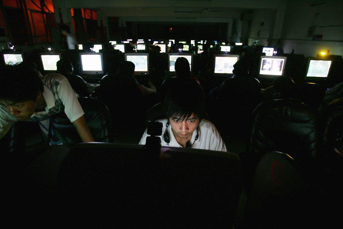 A Chinese man plays online games at an internet cafe in Wuhan, China, in this file photo. The Chinese regime's cyberstrategy is not fun and games, however, it is real cyberwar against the United States.  (Cancan Chu/Getty Images)