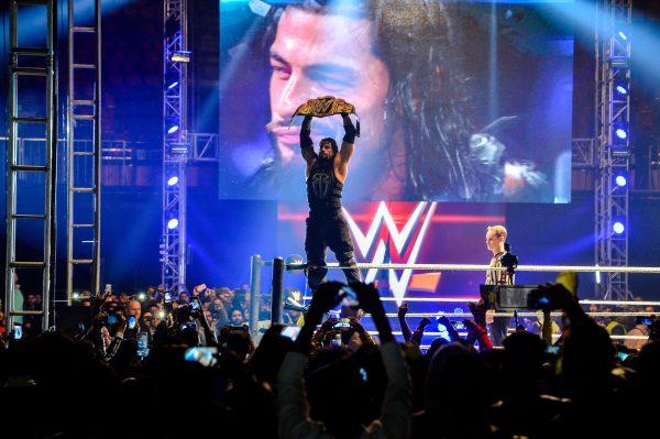 Reigns holds up the Championship Belt during the WWE Live India Tour in New Delhi, India, Jan. 15, 2018. (Chandan Khanna/AFP/Getty Images)