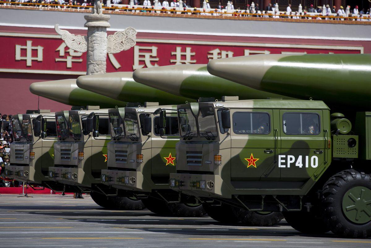 Military vehicles carrying DF-26 ballistic missiles drive past the Tiananmen Gate during a military parade in Beijing on Sept. 3, 2015. (Andy Wong/Pool /Getty Images)