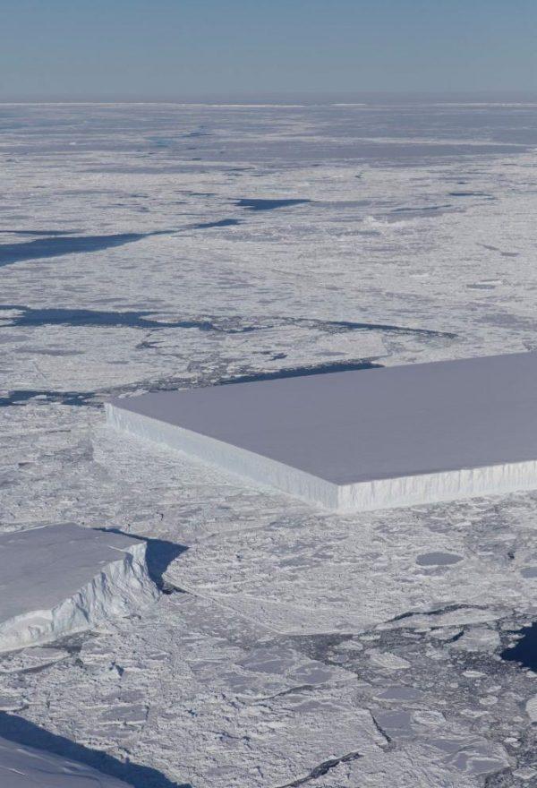 A tabular iceberg floating among sea ice just off of the Larsen C ice shelf in the Antarctic, captured by NASA on Oct. 16, 2018. (Jeremy Harbeck/NASA)