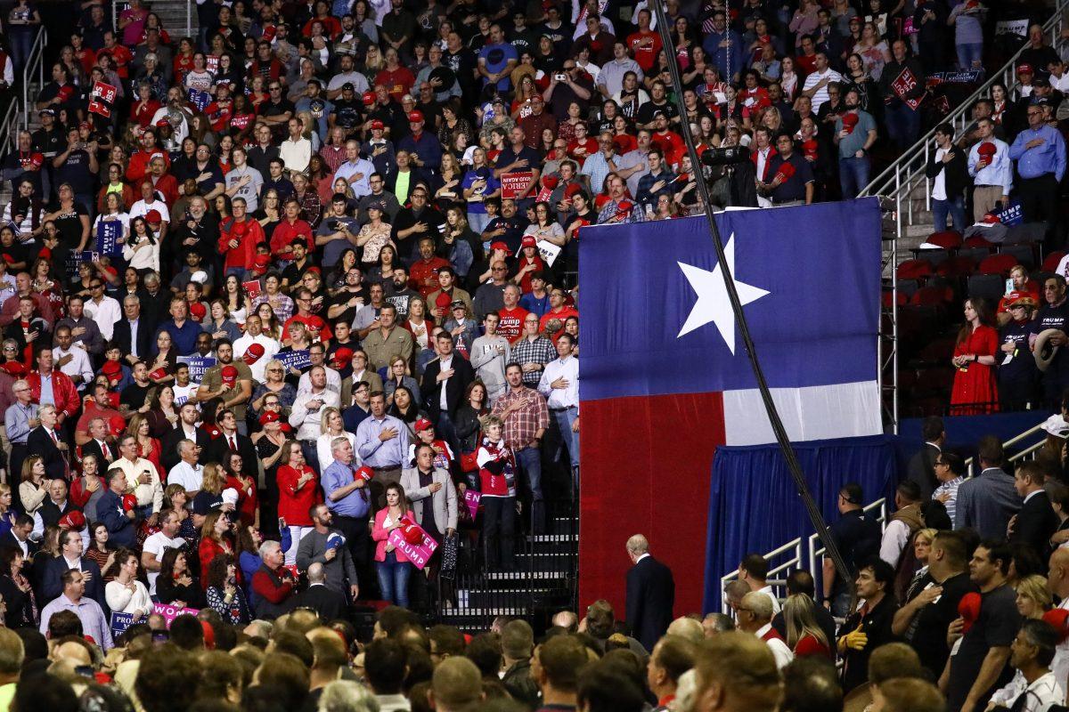 The audience recites allegiance to the Texas flag at a Make America Great Again rally in Houston, Texas, on Oct. 22, 2018. (Charlotte Cuthbertson/The Epoch Times)