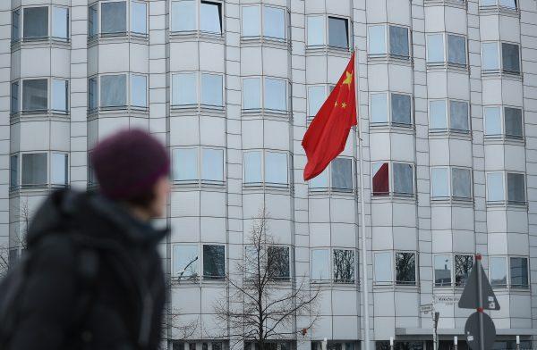 A woman walks past the Chinese Embassy on December 11, 2017 in Berlin, Germany. (Sean Gallup/Getty Images)