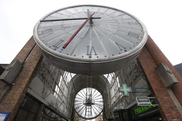 A ladder is put in place for a technician to service a huge clock in Cergy, France, in this file photo. (Thomas Samson/AFP/Getty Images)