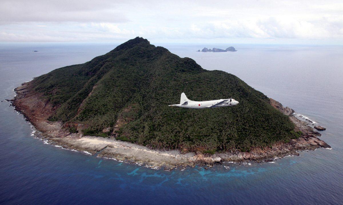 A Japanese patrol plane flying over the disputed islets known as the Senkaku Islands in Japan and Diaoyu Islands in China, located in the East China Sea on October 13, 2011. Muji has drawn the ire of Beijing over the Senkaku islands issue. (Japan Pool/AFP/Getty Images)