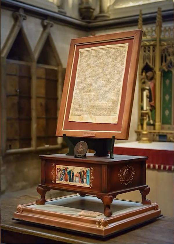 This copy of the Magna Carta, one of four dating to the year 1215, is kept in a glass enclosure in Salisbury Cathedral. (Screenshot/CNN)