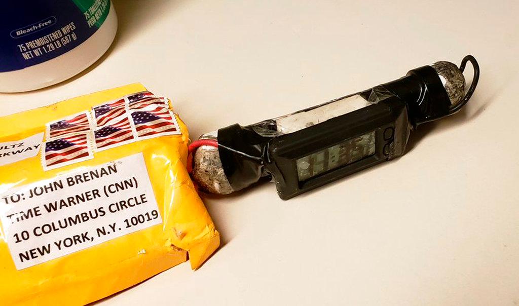 A package addressed to former CIA head John Brennan and an explosive device that was sent to CNN's New York office on Oct. 24, 2018. (ABC News via AP)