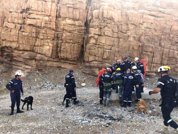 Jordanian rescuers with sniffer dogs search for survivors of flash floods at the Dead Sea area, Jordan, on Oct. 26, 2018. (AP Photo/Omar Akour)