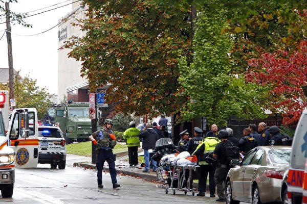 First responders surround the Tree of Life Synagogue in Pittsburgh, Pa., where a shooter opened fire on Oct. 27, 2018. (AP Photo/Gene J. Puskar)