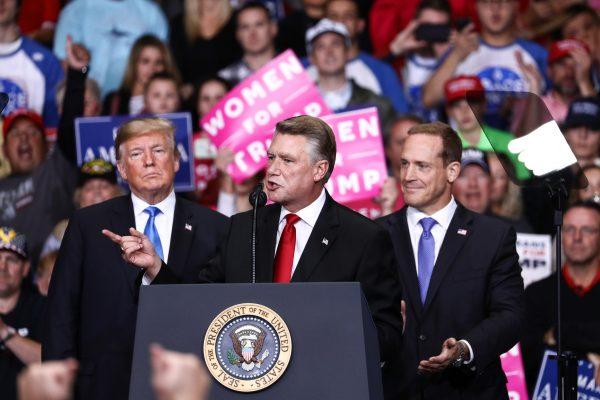 President Donald Trump and GOP congressional candidates Mark Harris (C) and Ted Budd at a Make America Great Again rally in Charlotte, N.C., on Oct. 26, 2018. (Charlotte Cuthbertson/The Epoch Times)