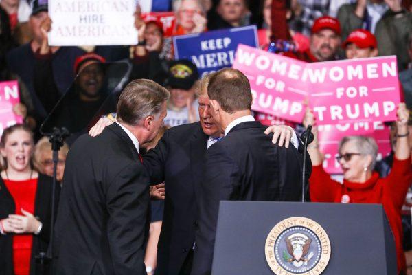 President Donald Trump and GOP congressional candidates Mark Harris (L) and Ted Budd at a Make America Great Again rally in Charlotte, N.C., on Oct. 26, 2018. (Charlotte Cuthbertson/The Epoch Times)
