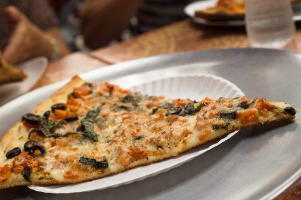 Slice of traditional New York-style pizza. (Shutterstock)