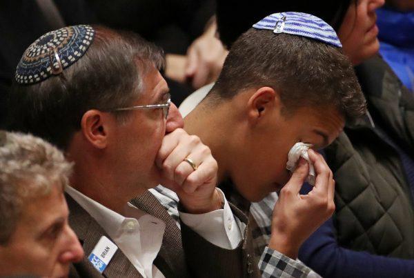Mourners react during a memorial service at the Sailors and Soldiers Memorial Hall of the University of Pittsburgh, a day after 11 worshippers were shot dead at a Jewish synagogue in Pittsburgh, Pennsylvania, U.S., October 28, 2018. (Cathal McNaughton/Reuters)