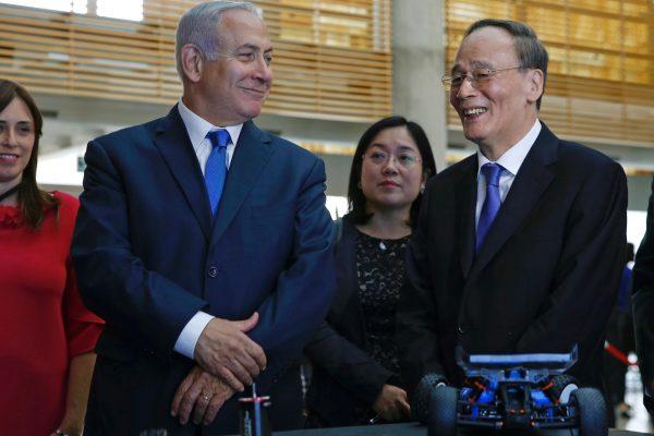 Chinese Vice Chair Wang Qishan during his tour with Israeli Prime Minister Benjamin Netanyahu of the Israeli Innovation Summit in Jerusalem on Oct. 24, 2018. (Ariel Schalit/AFP/Getty Images)