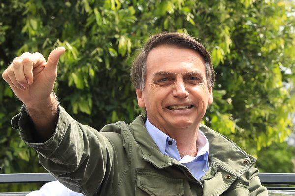 Jair Bolsonaro gestures after casting his vote during general elections in Rio de Janeiro on Oct. 28, 2018. (Buda Mendes/Getty Images)