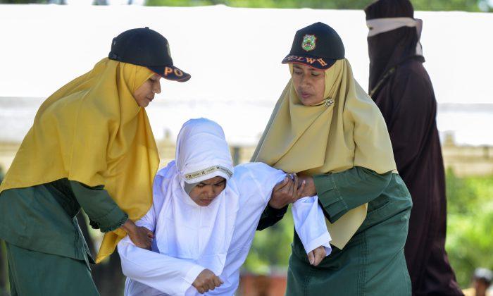 Woman, 21, Publicly Caned for ‘Close Proximity’ to Boyfriend in Indonesia