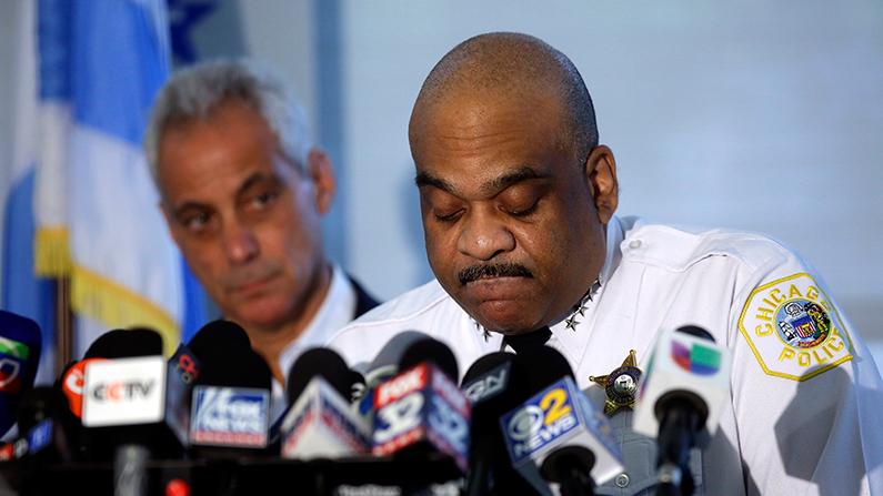 In an August 6, 2018 file photo, Chicago Mayor Rahm Emanuel listens as Chicago Police Superintendent Eddie Johnson speaks about a weekend of gun violence during a news conference at the Chicago Police Department 6th District station. (Joshua Lott/Getty Images)