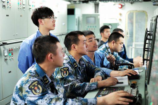 People’s Liberation Army sailors work aboard China’s first domestically built aircraft carrier during its first trial at sea on May 18, 2018. (AFP/Getty Images)