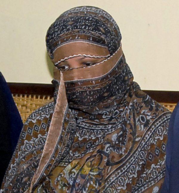 Asia Bibi, a Pakistani Christian woman, listens to officials at a prison in Sheikhupura near Lahore, Pakistan, on Oct. 31, 2018. (AP)