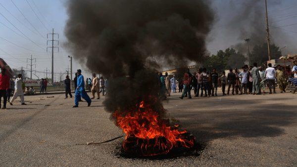 Supporters of a Pakistani religious group burn tires while block a main road during a protest after a court decision in Karachi, Pakistan, on Oct. 31, 2018. (Shakil Adil/AP)