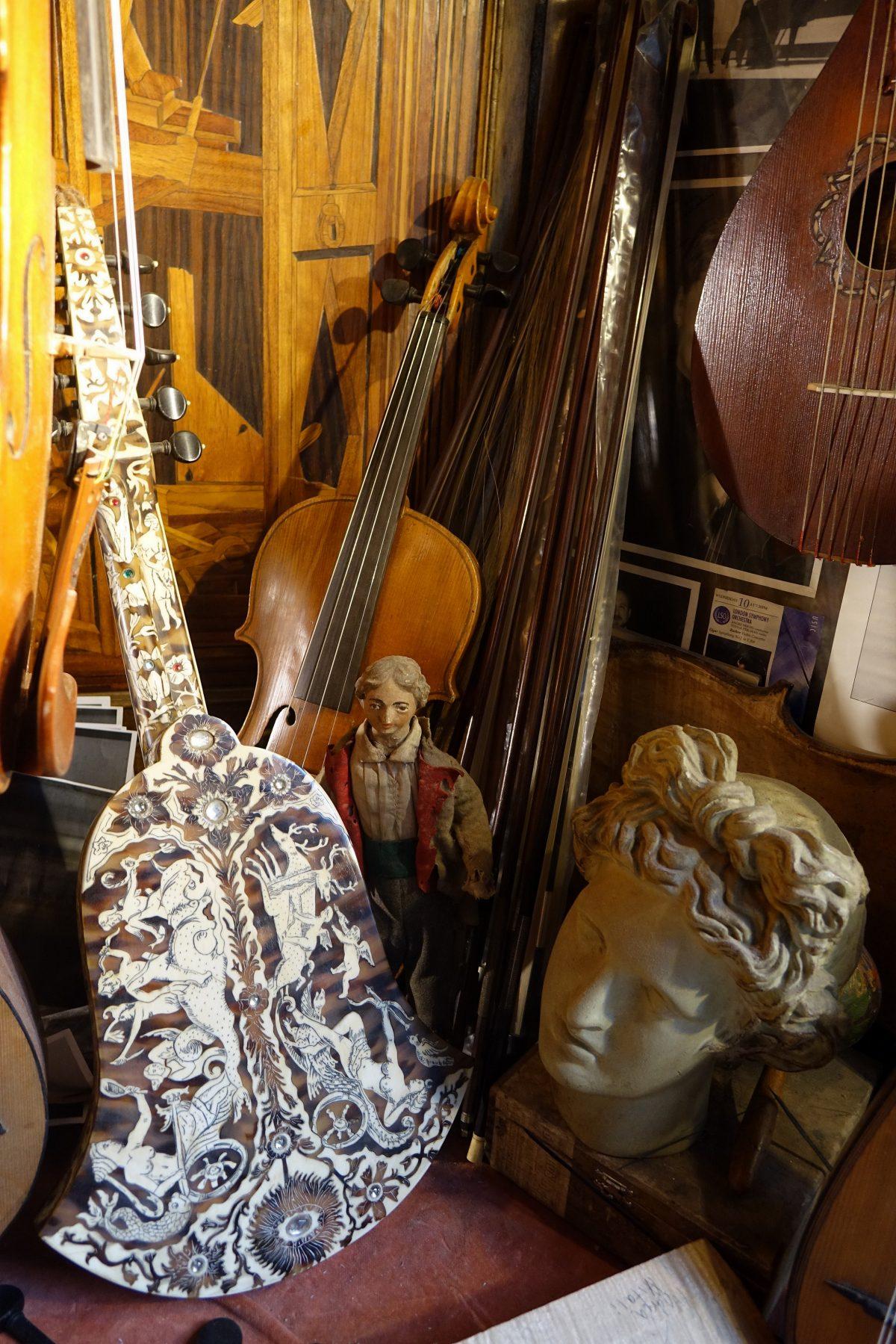 A selection of Jamie Lazzara's traditional handmade and restored stringed instruments in the window of her workshop in Florence, Italy. (Paolo Boni)
