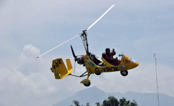 A gyrocopter flies by Woodland Airpark in Angeles City, in the Philippines, on Sept. 6, 2010. (Ted Alijbe/AFP/Getty Images)