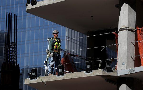 A construction worker on a floor of a building under construction in San Francisco on Oct. 5, 2018. (Justin Sullivan/Getty Images)