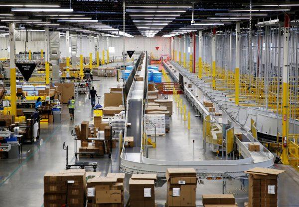 The ship sorter automatically feeds packages for delivery by speed and location to chutes connected to delivery trucks at the Amazon fulfillment center in Kent, Washington, U.S., October 24, 2018. (Lindsey Wasson/File Photo/Reuters)