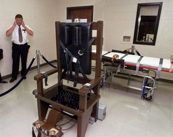 Ricky Bell, the warden at Riverbend Maximum Security Institution in Nashville, gives a tour of the prison's execution chamber on Oct. 13, 1999. (AP Photo/Mark Humphrey, File)
