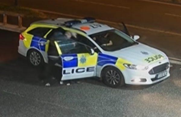 Security camera footage showing Smith forcibly ejecting a police officer from her patrol car in Sussex, UK, July 6, 2018. (Sussex Police)