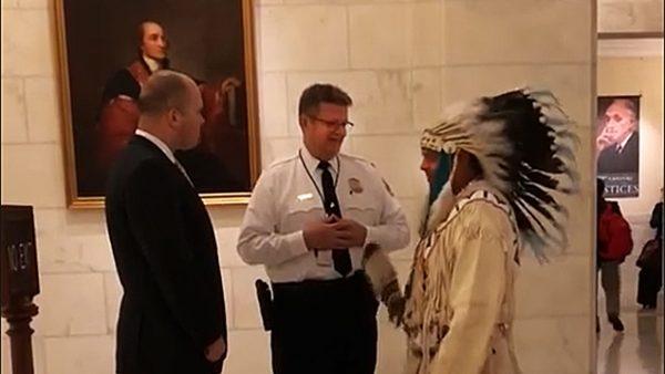 Yakama Nation Tribal Council Chairman JoDe Goudy speaks with Supreme Court security agents regarding his right to enter the courtroom. (JoDe Goudy via Storyful screenshot)