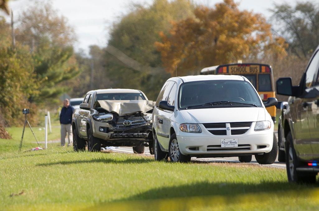 Emergency personnel responded to a scene of a collision that killed three children crossing SR 25 as they were boarding their school bus north of Rochester, Ind. on Tuesday, Oct. 30, 2018,. (Santiago Flores/South Bend Tribune via AP)