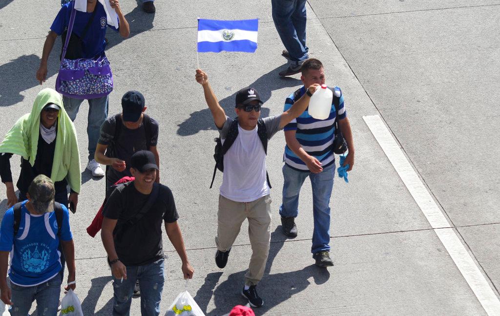 Migrants from El Salvador start on their way to the United States, in San Salvador, El Salvador, Oct. 31, 2018. (AP Photo/Diana Ulloa)