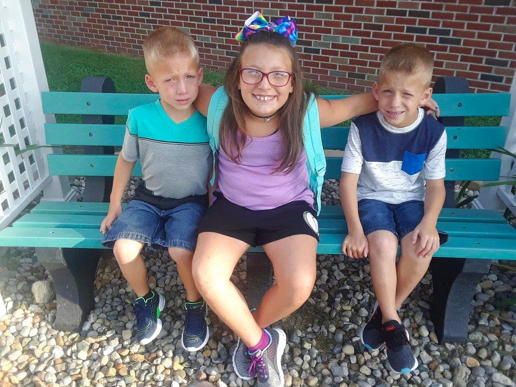 Alivia Stahl (C), and her twin brothers, Xzavier and Mason Ingle in an undated photo, were killed in Rochester, Ind., on Oct. 30, 2018. (Elgin Ingle via AP)