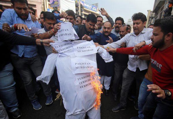 Demonstrators burn an effigy depicting "terrorism" as they shout anti-Pakistan slogans during a protest against the killing of a leader of India's ruling Hindu nationalist Bharatiya Janata Party's (BJP), and his brother by unidentified gunmen in Kishtwar town, in Jammu, on Nov. 2, 2018. (Mukesh Gupta/Reuters)
