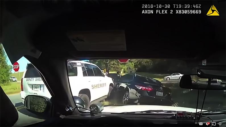 A police vehicle pins Becker in her car, on Oct. 30, 2018. (Screenshot/LiveLeak/YouTube)