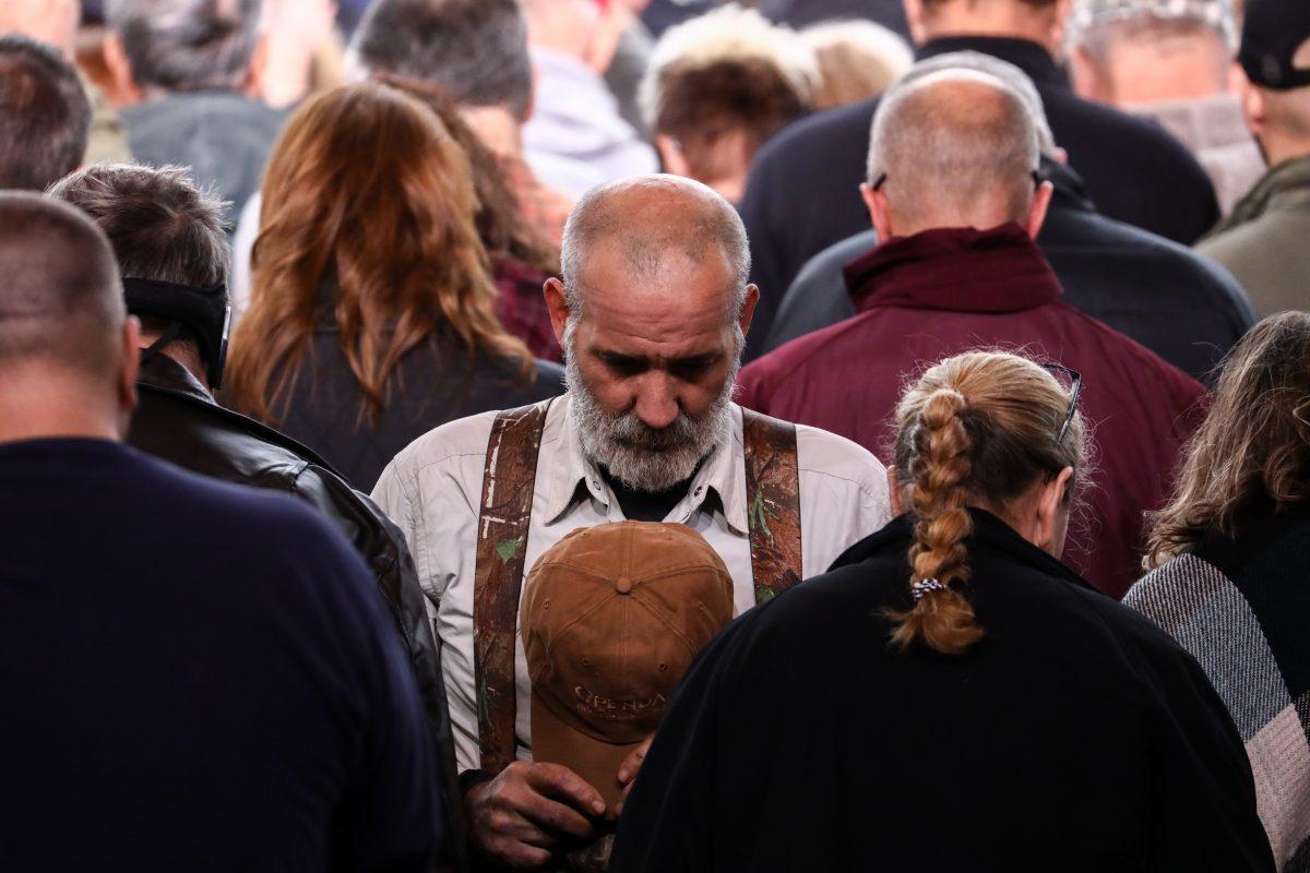 Attendees during the prayer at a Make America Great Again rally in Huntington, W.Va., on Nov. 2, 2018. (Charlotte Cuthbertson/The Epoch Times)