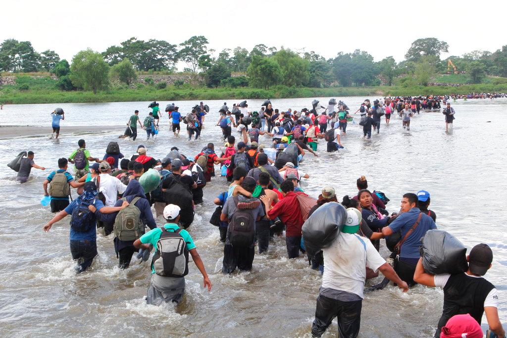 Another migrant caravan crosses the Suchiate River, the border between Guatemala and Mexico, on Nov. 2, 2018. (Diana Ulloa/AP Photo)