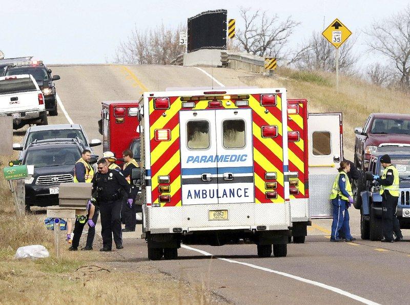 Emergency medical personnel gather at the scene of a hit-and-run accident on Nov. 3, 2018, in Lake Hallie, Wis., that killed three girls and an adult. (Steve Kinderman/The Eau Claire Leader-Telegram via AP)