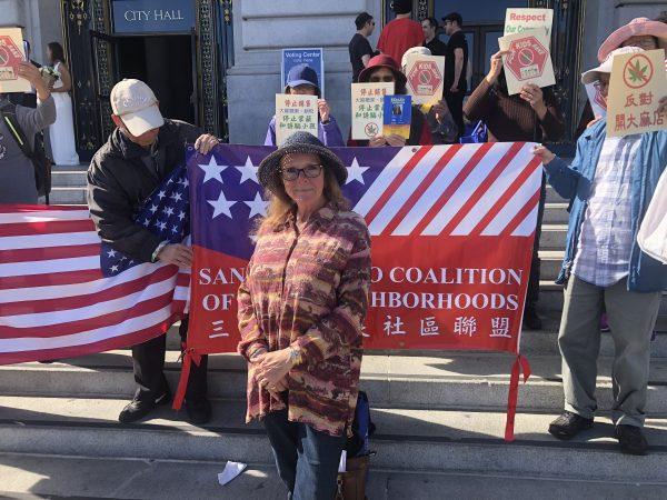 Lou Ann Bassan joins the San Francisco Coalition for Good Neighborhoods to protest permits for recreational marijuana stores in front of city hall in San Francisco, Calif. on Nov. 2, 2018. (Nathan Su/The Epoch Times)
