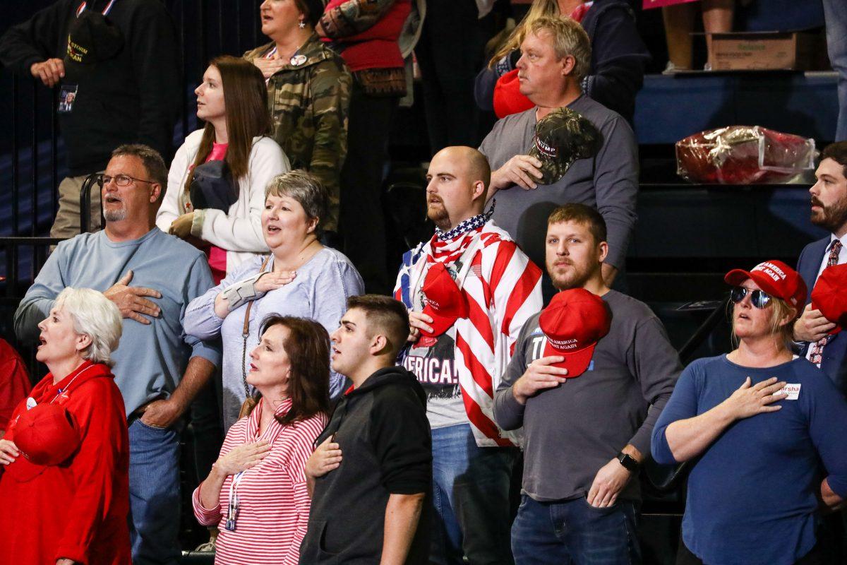 Attendees recite the Pledge of Allegiance at a Make America Great Again rally in Chattanooga, Tenn., on Nov. 4, 2018. (Charlotte Cuthbertson/The Epoch Times)